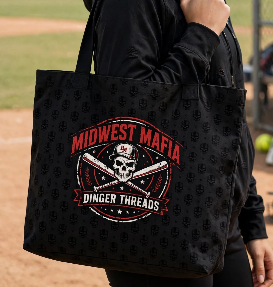 Adult softball fan carrying the black Midwest Mafia tote bag at the ballfield
